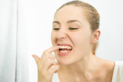 How does plaque lead to bleeding gums?
